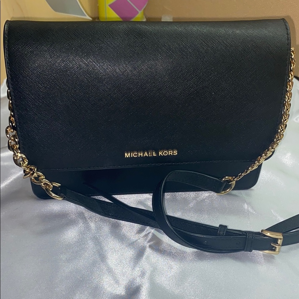 Michael Kors Black and Gold Crossbody Bag with Flap Closure
